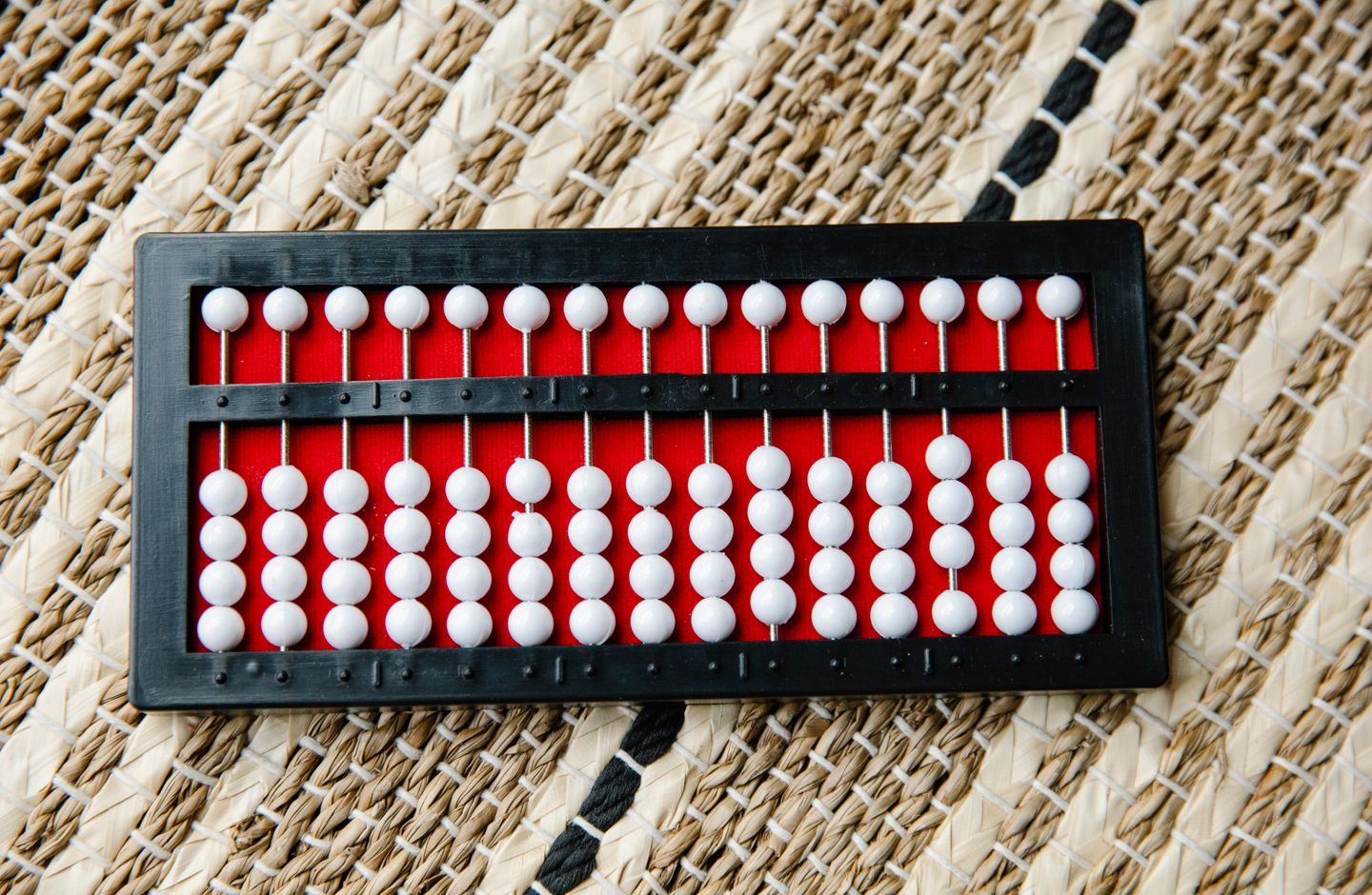 A close-up photo of a wooden abacus, a classic tool for counting.